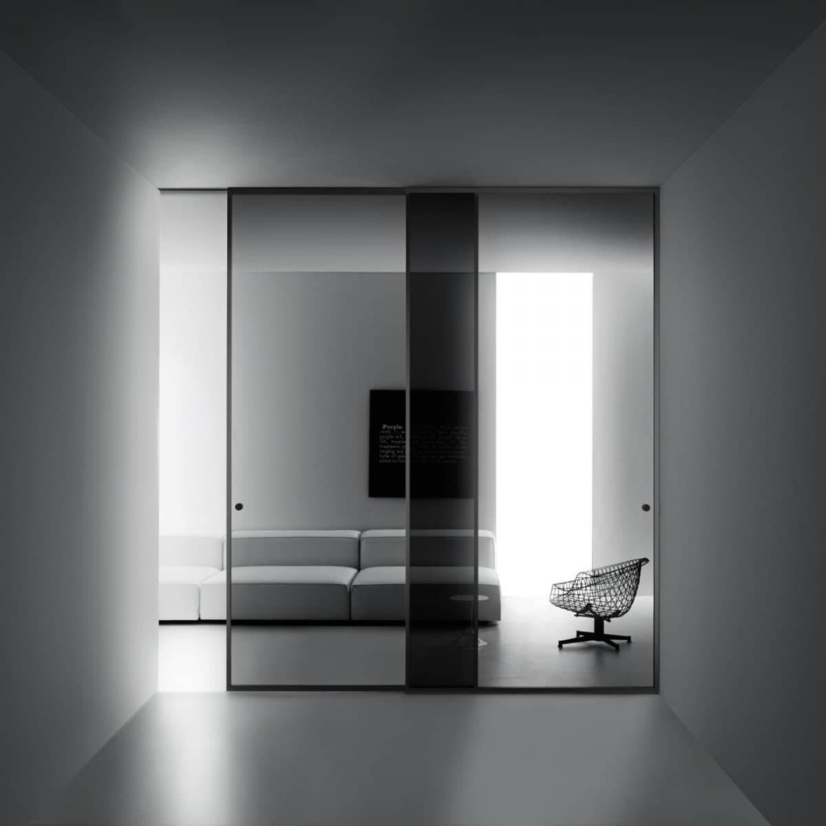Glas Italia glazen schuifdeur met aluminium kader als transparante overgang tussen woonruimtes