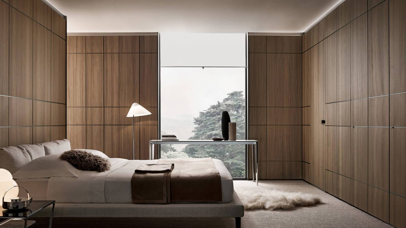 design slaapkamerontwerp met wandpanelen in notenhout en geïntegreerde rimadesio moon kozijnloze deur vlaklopend met de wand