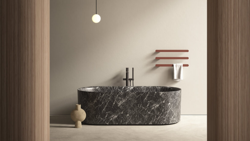 Antonio Lupi Nebula vrijstaand marmeren bad met donkere natuursteen, geplaatst in een minimalistische architectonische badkamer