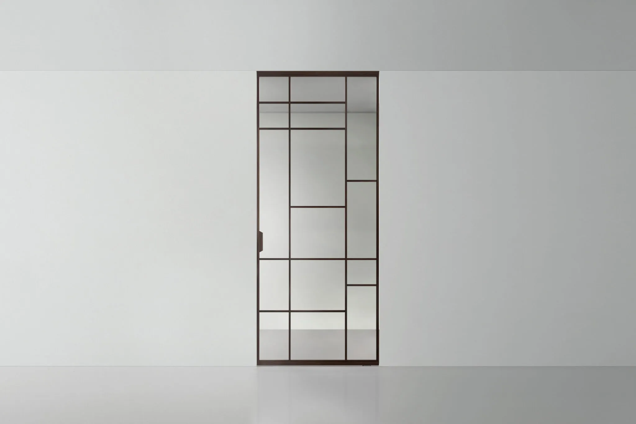 Transparante design taatsdeur in glas en aluminium uit de Rimadesio Air collectie